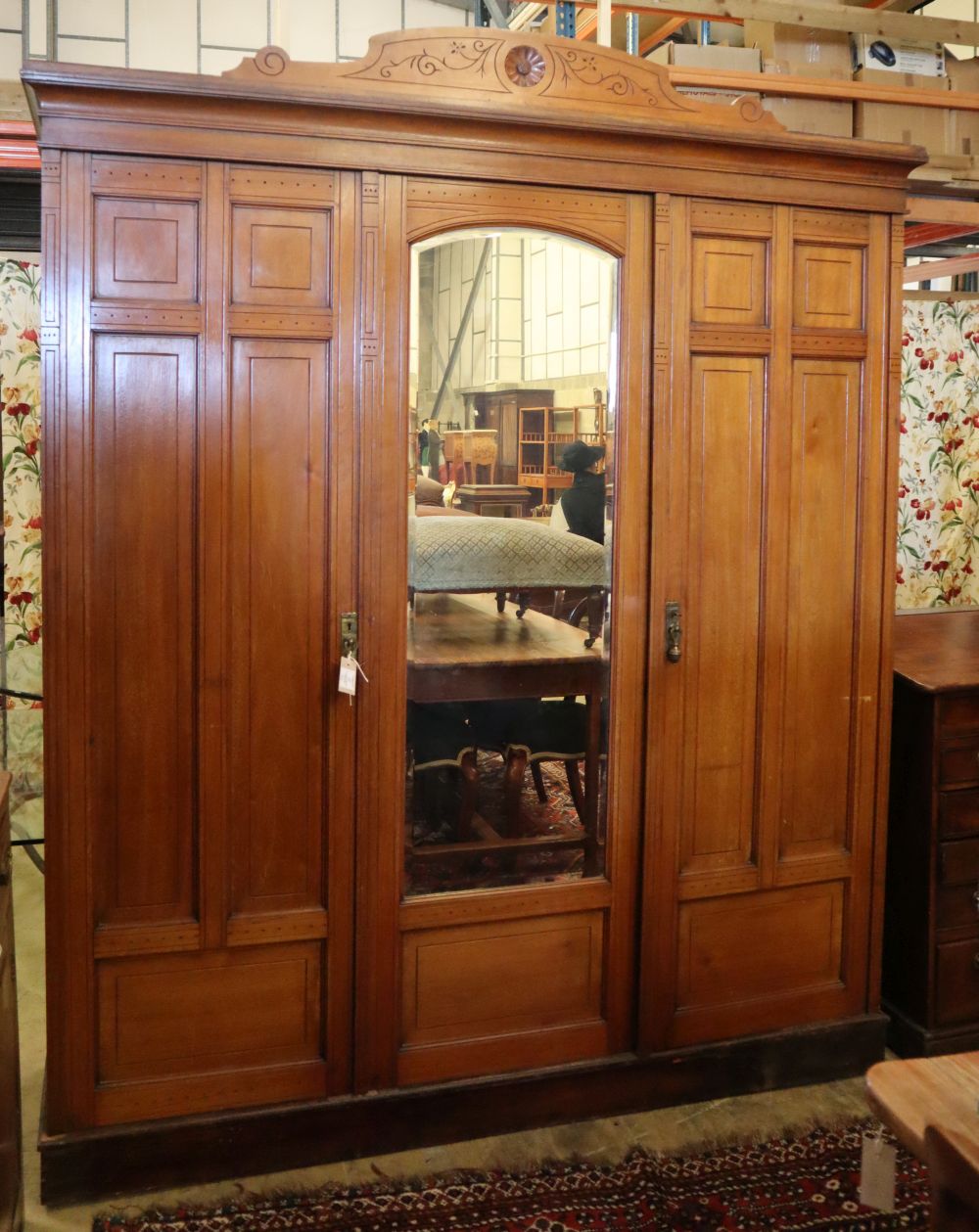 A late Victorian aesthetic movement walnut compactum wardrobe, W.185cm, D.58cm, H.222cm